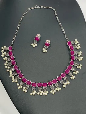 Dazzling Rectangle Pink Stone Studded Flower Designed Silver Toned Oxidized Necklace Set With Earrings