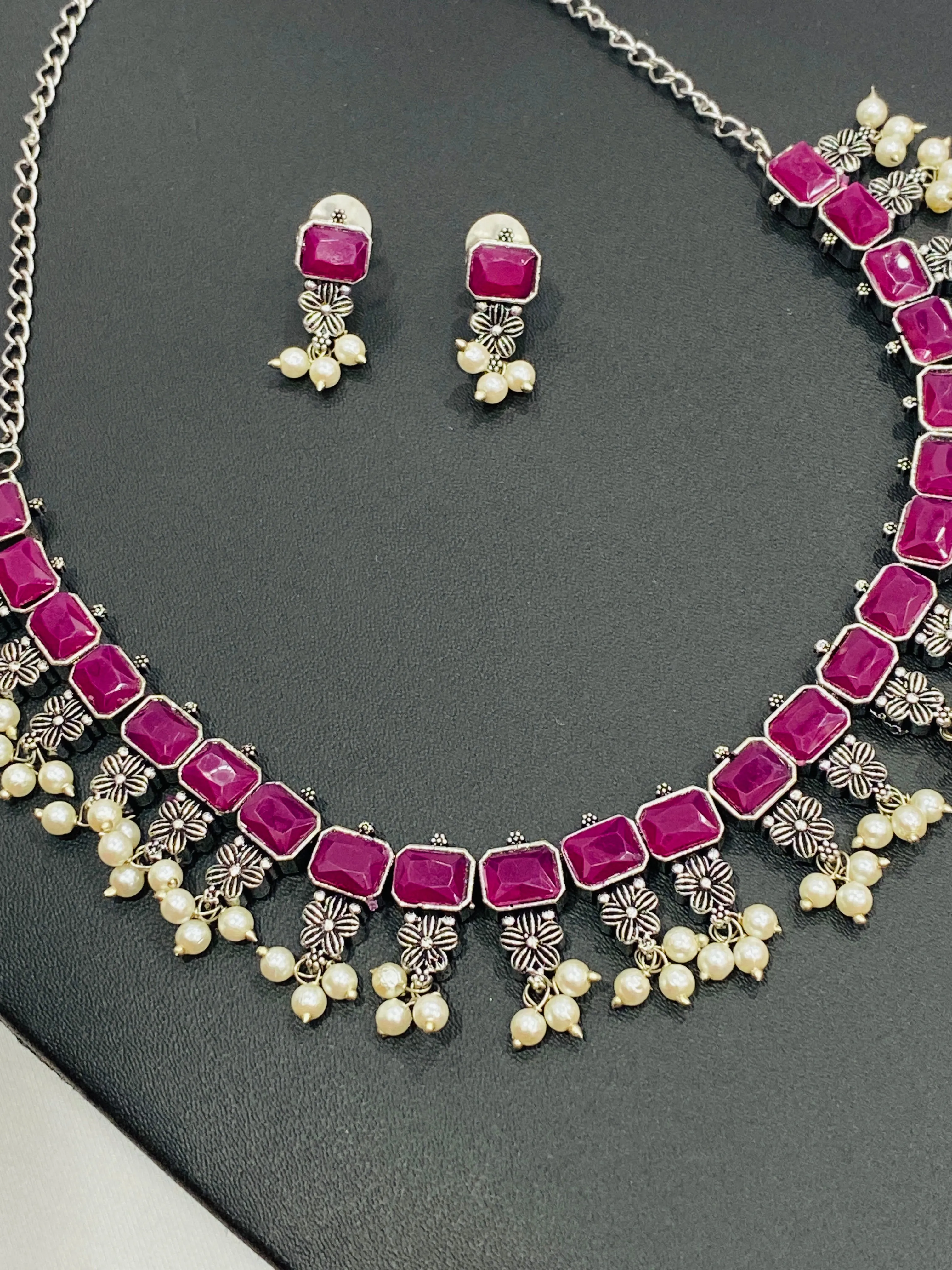 Dazzling Rectangle Pink Stone Studded Flower Designed Silver Toned Oxidized Necklace Set With Earrings