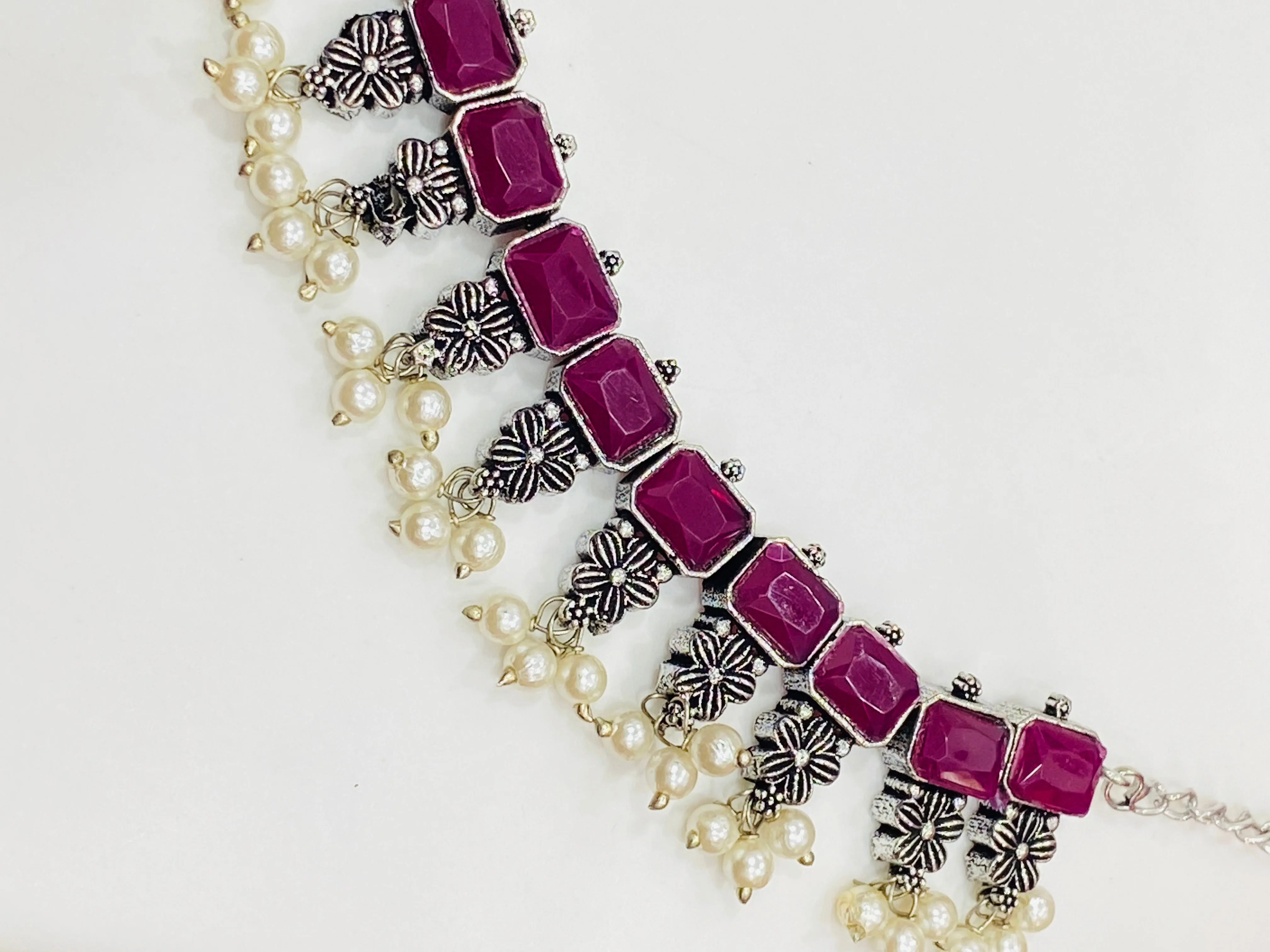 Dazzling Rectangle Pink Stone Studded Flower Designed Silver Toned Oxidized Necklace Set With Earrings